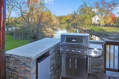 River Livin main level back deck with outdoor kitchen