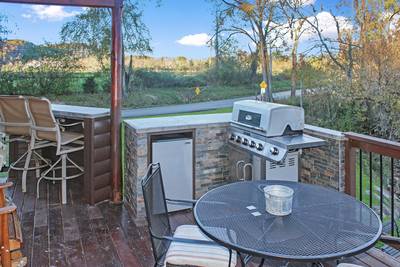 River Livin main level back deck with outdoor kitchen