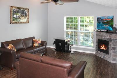Wolff Lodge living room with cocktail style arcade machine