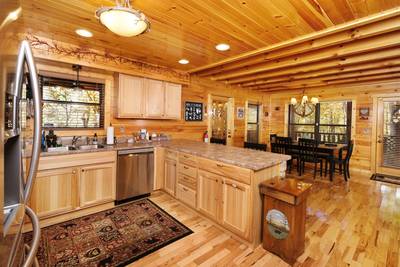 Bearfoots Cozy Cabin fully furnished kitchen and dining area