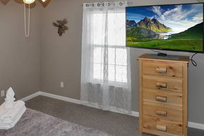 Alluring River upper level bedroom 3 with 55-inch TV