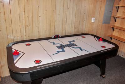 Alluring River lower level game room air hockey table