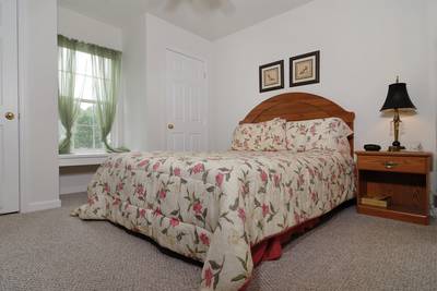 Henderson's Riverside bedroom one with queen size bed