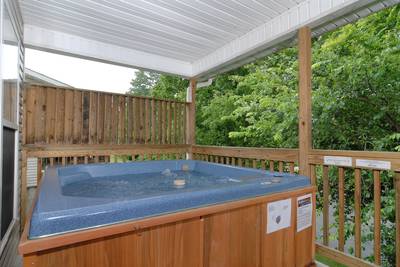 Grand River Canyon covered back deck with hot tub