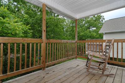 Grand River Canyon covered back deck with rocking chair