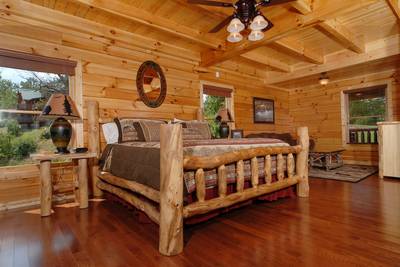 A Cabin of Dreams main level bedroom with king size bed