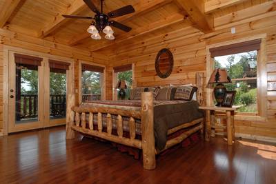 A Cabin of Dreams main level bedroom with king size bed