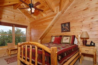A Cabin of Dreams upper level bedroom with queen size bed