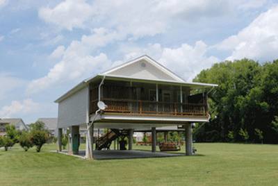 River Escape covered back deck with hot tub