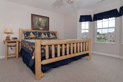 River Escape bedroom one with king size log bed