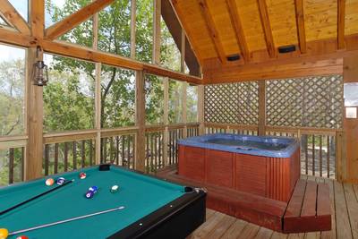 Papa's Pad screened in back deck with pool table and hot tub