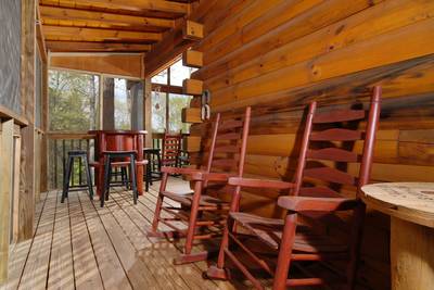 Papa's Pad screened in back deck with rocking chairs