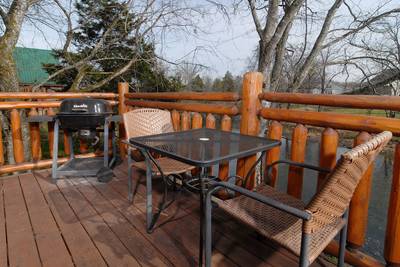 River Falls back deck with table chairs and grill