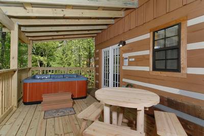 Cozy Bear Escape covered back deck with hot tub