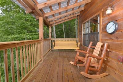 Beary Beary Special main level covered back deck with rocking chairs and swing