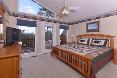 Pigeon Forge Chalet Rental Bedroom with a Flat Screen Television