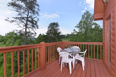 Pigeon Forge Convenient Chalet Rental with an outdoor seating area great for morning coffee