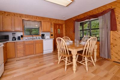 Lakeview dining table and fully furnished kitchen
