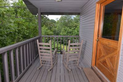 Lakeview covered deck with rocking chairs