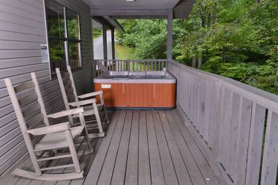 Lakeview covered back deck with hot tub