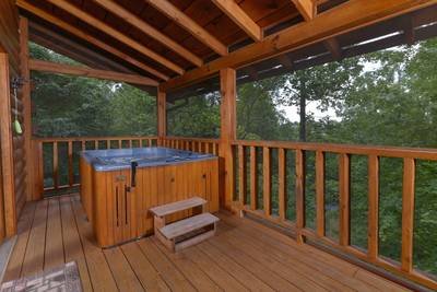 The Cabin at SunRae Ridge screened in back deck with hot tub