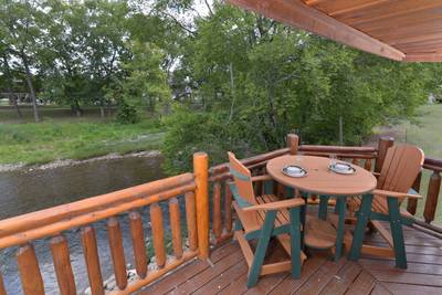 Down by the River back deck with high top table and chairs