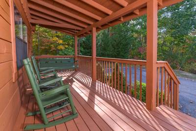Serenity Ridge covered entry deck with rocking chairs