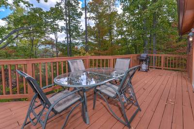 Serenity Ridge back deck with table and chairs